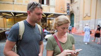 A man and a woman traveling in Italy