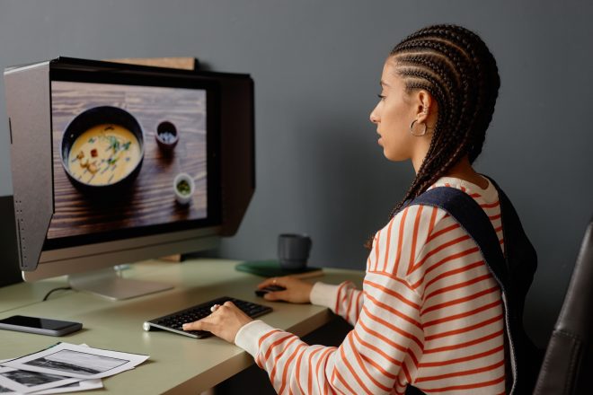 Black Woman using Computer Editing Food Photography Images