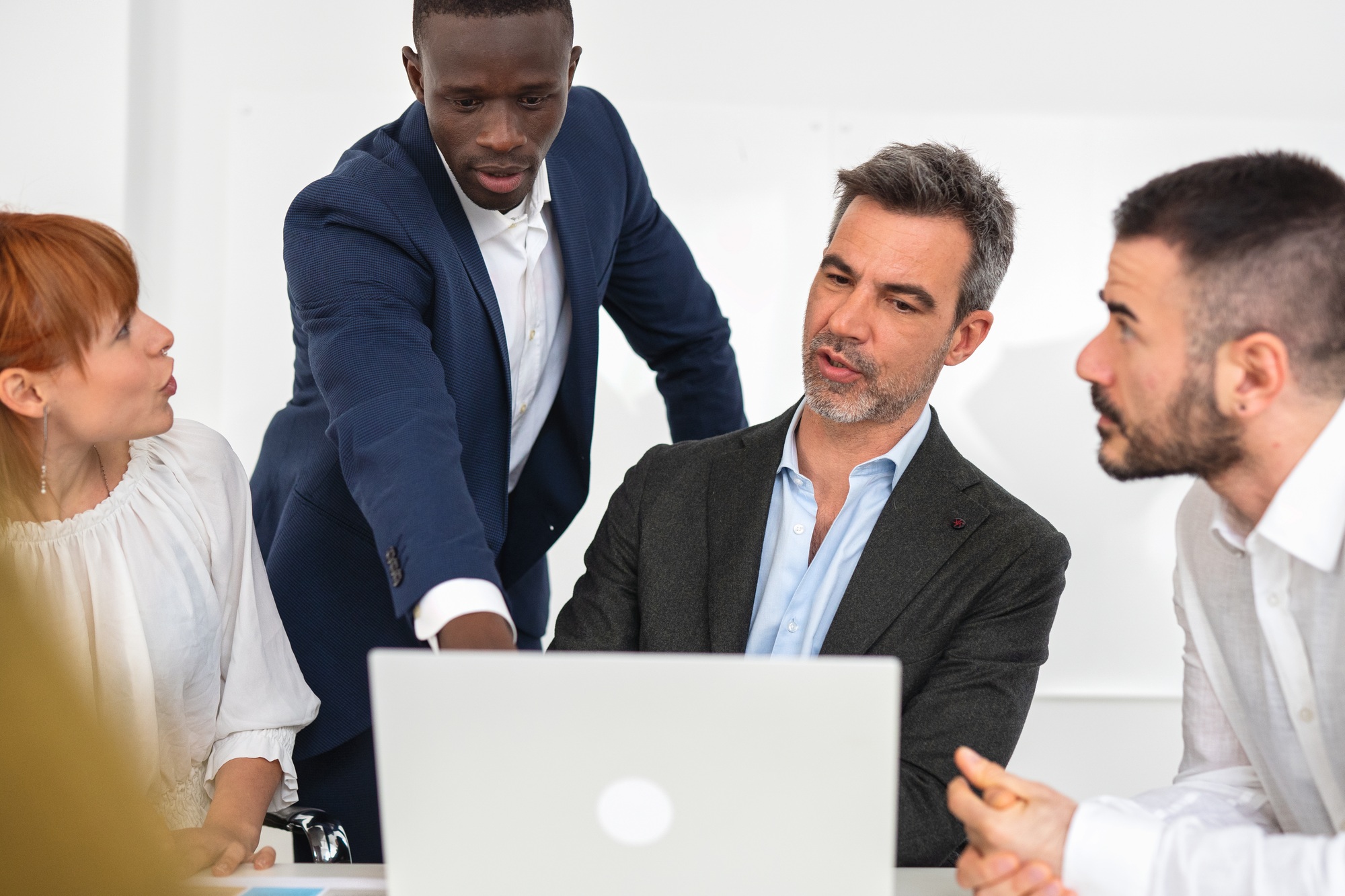 Businessman explaining new business ideas to colleagues.