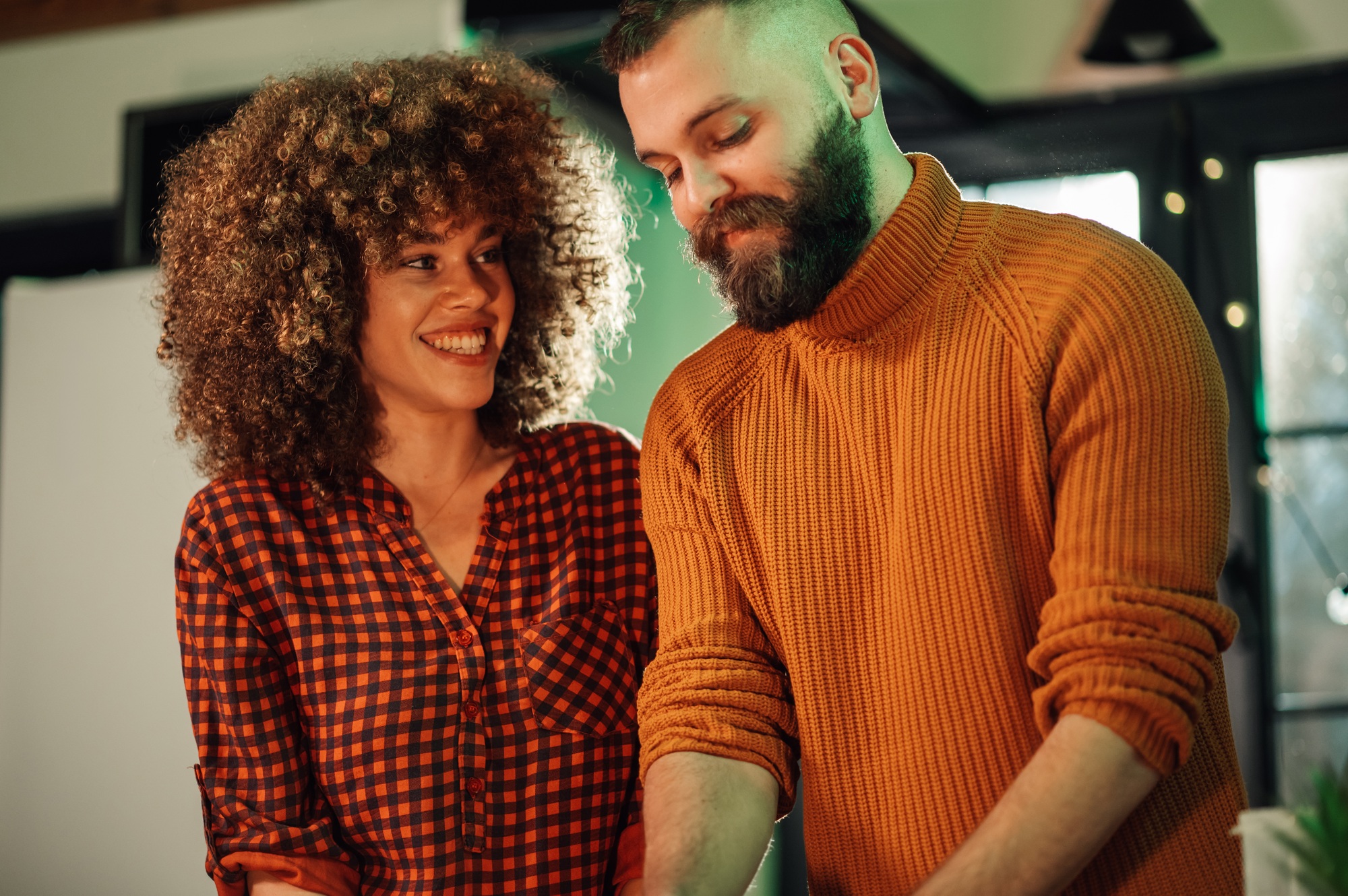 Colleagues collaborating on project, sharing ideas in startup office