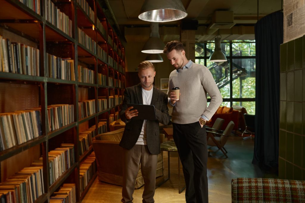 Executive manager showing report on mobile tablet to colleague or team leader