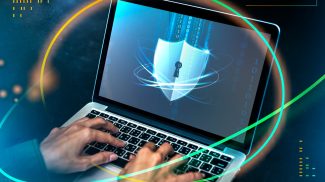 Hacker cracking the security code on a laptop