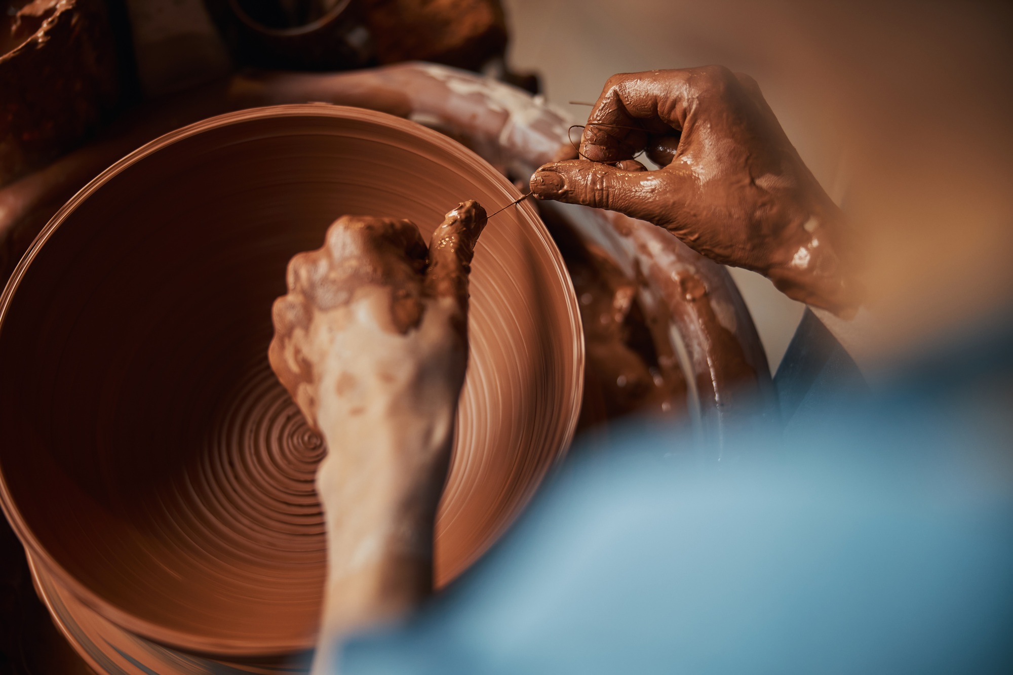 Image of process manufacturing and shaping ceramic tableware in pottery workshop