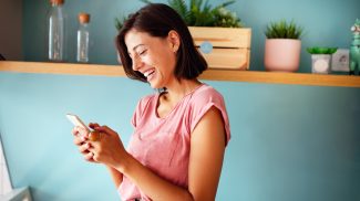 Image of young woman using cellular phone