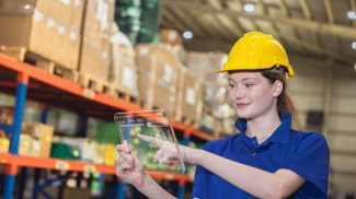 modern worker using digital tablet device with logistics inventory management software