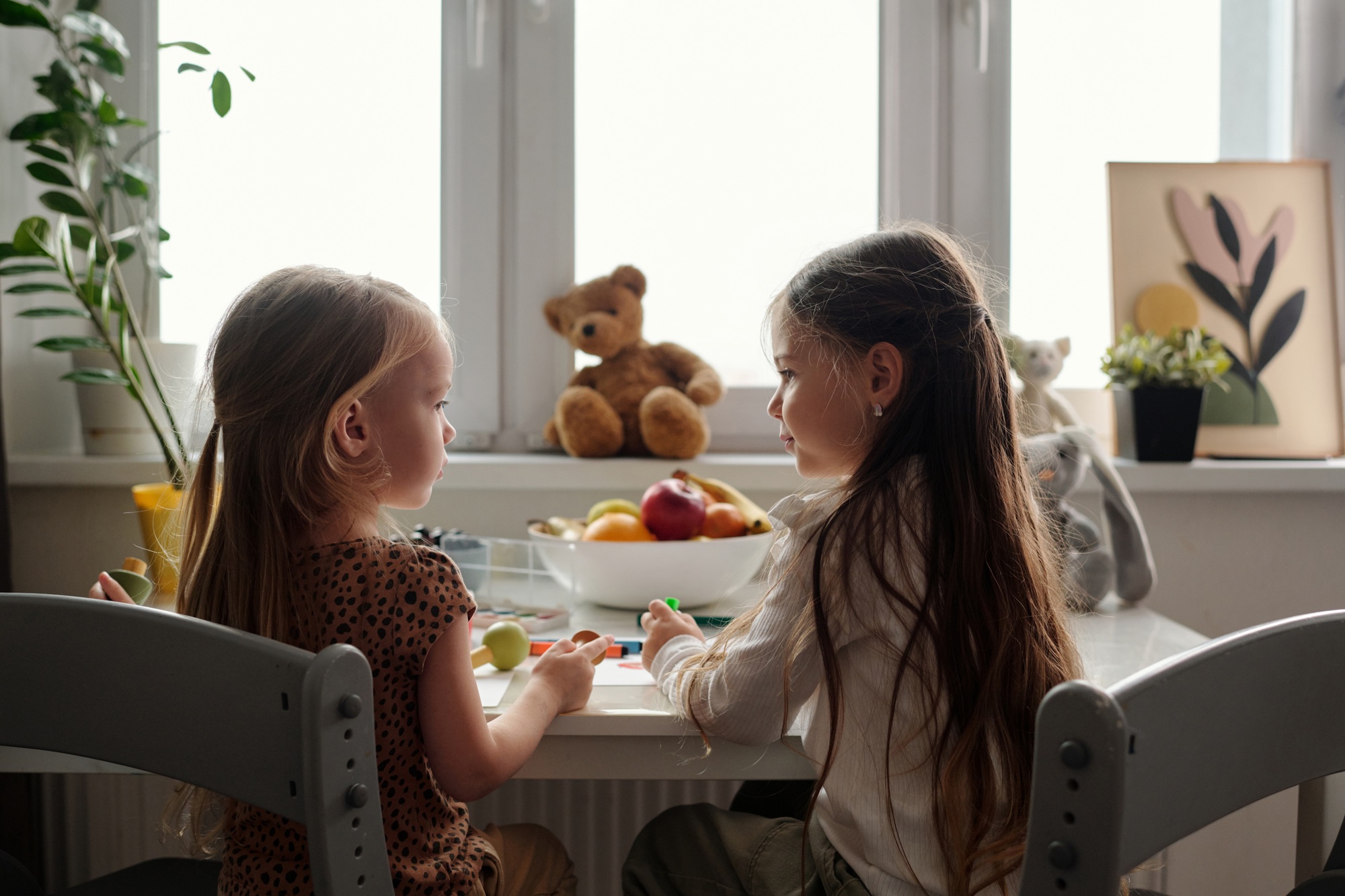 Pretty siblings discussing new ideas