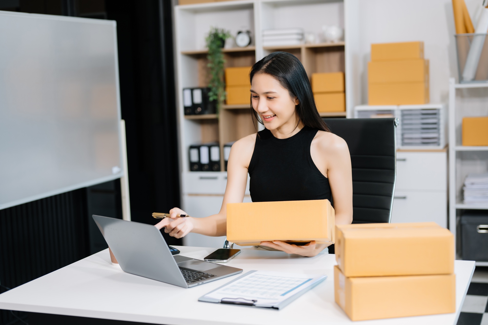 Small business entrepreneur SME freelance woman working at home office, BOX,tablet