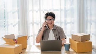 Startup small business entrepreneur SME, asian senior man receive order on phone