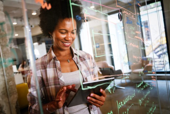 Success black woman with tablet, analytics and developer for startup business website IT software