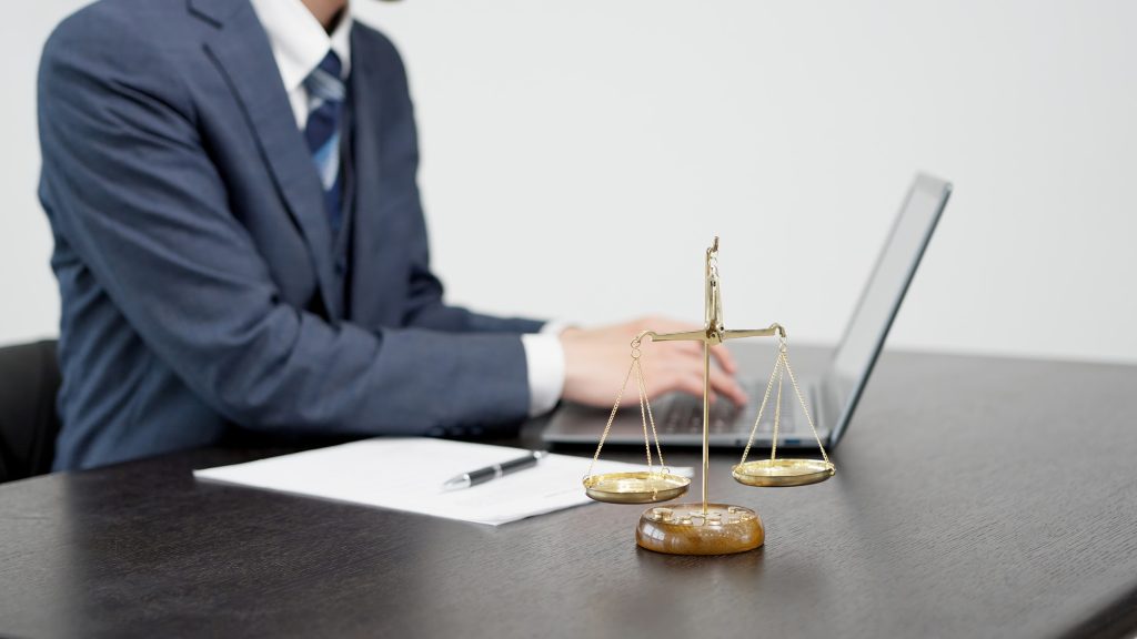 The hands of a businessman conducting a survey on a computer