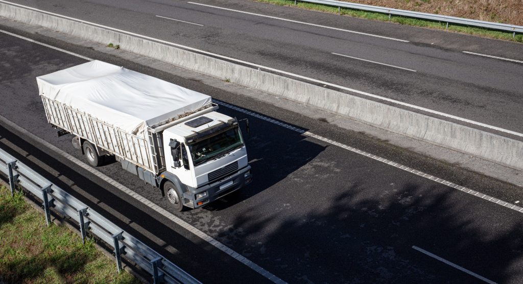 Truck on road with clear container
