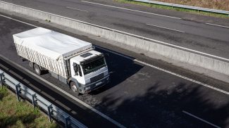 Truck on road with clear container