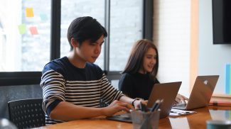 Young business team working and discussing new startup project in office.